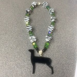 Chunky green and white necklace with lamb pendant